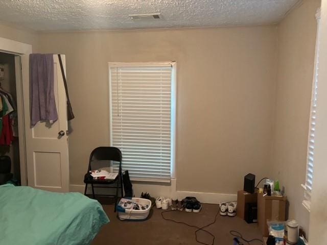 bedroom featuring a textured ceiling