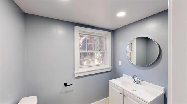 bathroom with vanity and toilet