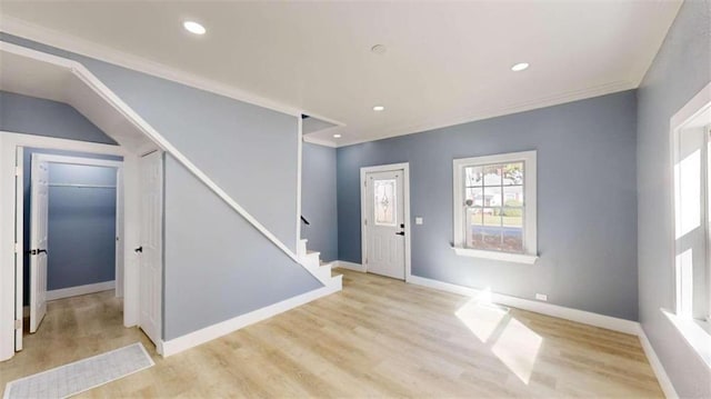 foyer featuring light hardwood / wood-style floors and ornamental molding