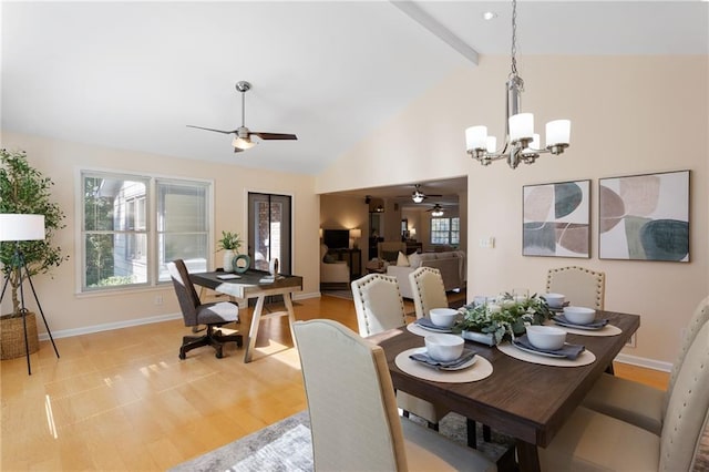 dining room featuring beam ceiling, ceiling fan with notable chandelier, light wood-type flooring, and high vaulted ceiling