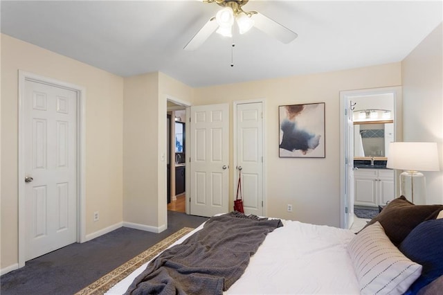 bedroom with connected bathroom, ceiling fan, and dark colored carpet