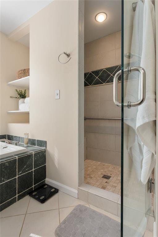 bathroom with walk in shower and tile patterned floors