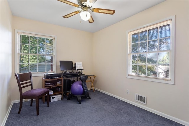 office featuring dark carpet and ceiling fan