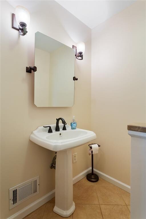 bathroom with tile patterned flooring