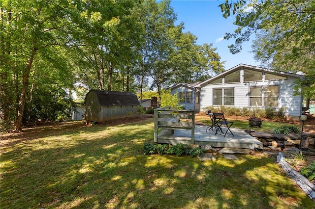 view of yard featuring a shed and a deck