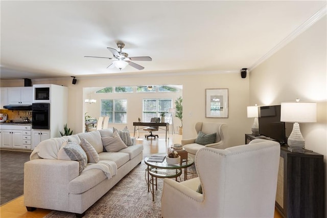 living room featuring crown molding and ceiling fan