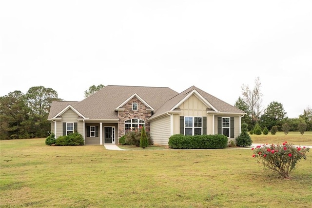 view of front facade featuring stone siding, board and batten siding, and a front yard