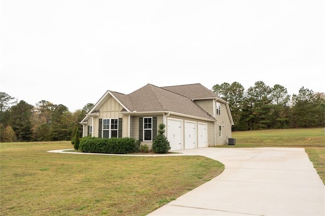 view of front of home featuring board and batten siding, concrete driveway, an attached garage, and a front lawn