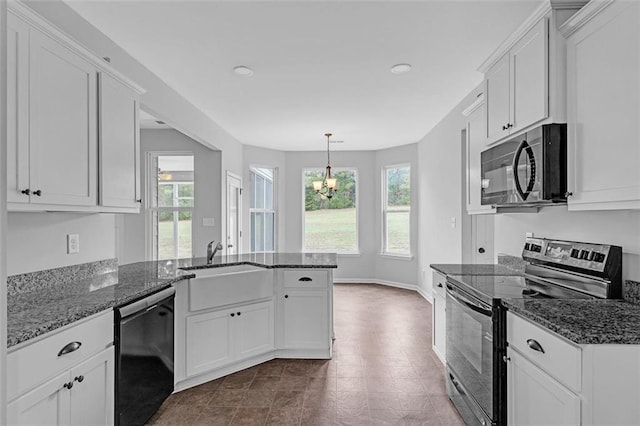 kitchen featuring electric range oven, dishwashing machine, a peninsula, and white cabinetry