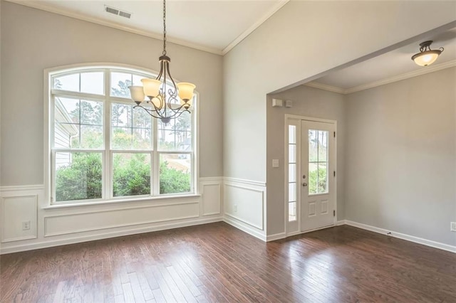 foyer featuring plenty of natural light, crown molding, visible vents, and dark wood-style flooring