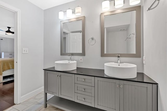 6851 Roswell Rd Unit J1, Atlanta, GA 30328 - ensuite bathroom with marble finish flooring, double vanity, and baseboards