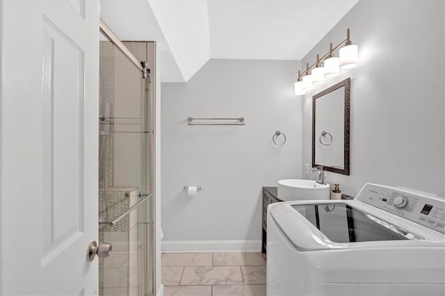 6851 Roswell Rd Unit J1, Atlanta, GA 30328 - bathroom featuring washer / dryer, marble finish flooring, a shower stall, vanity, and baseboards