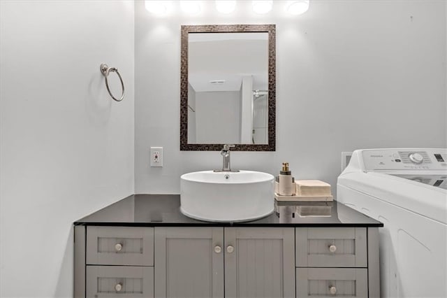 6851 Roswell Rd Unit J1, Atlanta, GA 30328 - bathroom featuring washer / dryer and vanity
