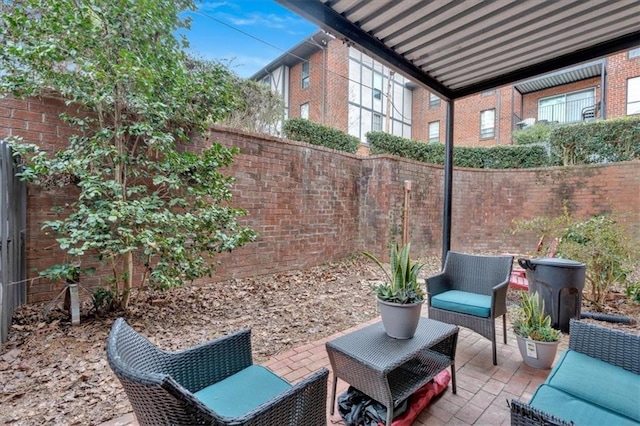 6851 Roswell Rd Unit J1, Atlanta, GA 30328 - fenced backyard with a patio and an outdoor hangout area