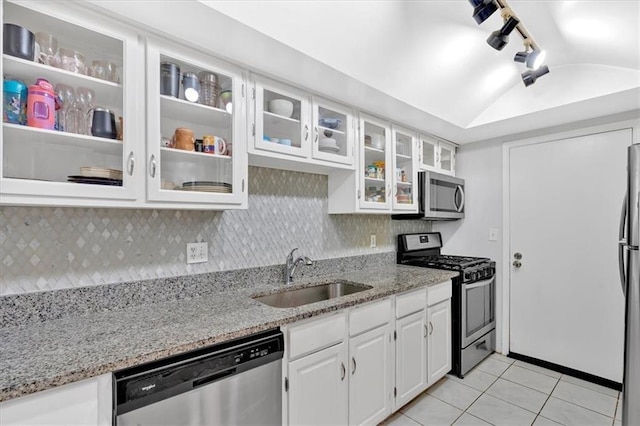 6851 Roswell Rd Unit J1, Atlanta, GA 30328 - kitchen with appliances with stainless steel finishes, a sink, light tile patterned floors, white cabinets, and rail lighting