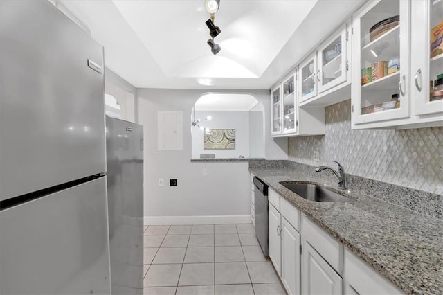 6851 Roswell Rd Unit J1, Atlanta, GA 30328 - kitchen with stainless steel appliances, a sink, light tile patterned floors, white cabinets, and a tray ceiling