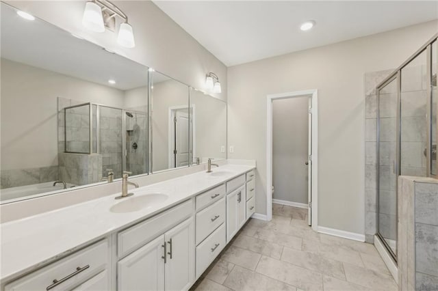 bathroom featuring vanity, a shower with door, and toilet