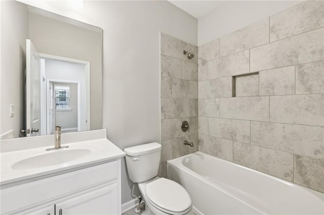 full bathroom with vanity, toilet, and tiled shower / bath combo