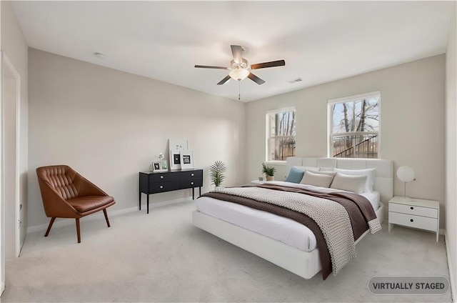 carpeted bedroom featuring ceiling fan