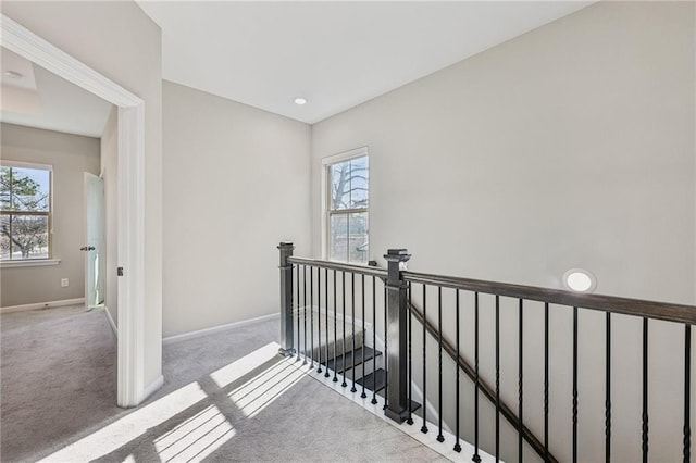 corridor with light colored carpet