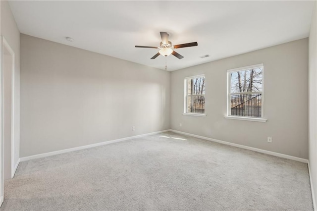 carpeted empty room with ceiling fan