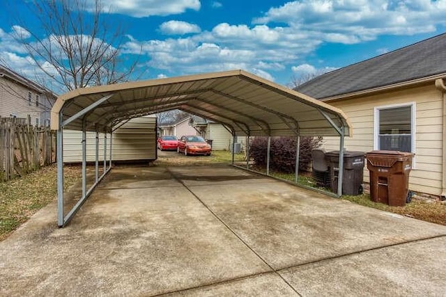 view of vehicle parking with a carport