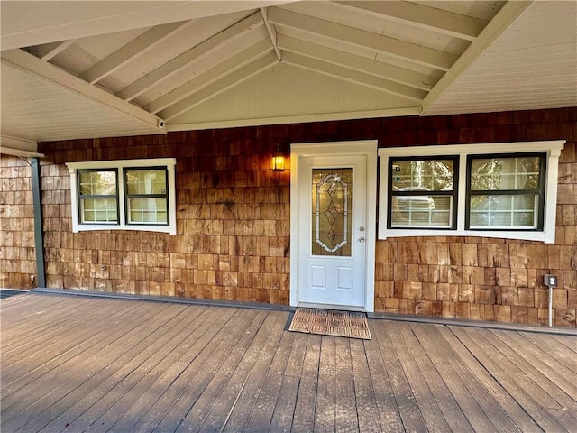 property entrance featuring a wooden deck