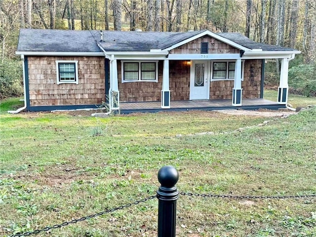 ranch-style home with a front lawn and a porch