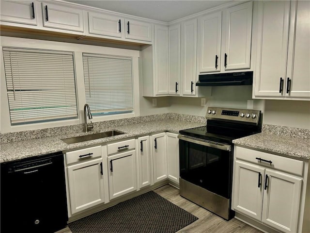 kitchen featuring stainless steel range with electric cooktop, black dishwasher, sink, light hardwood / wood-style floors, and white cabinets