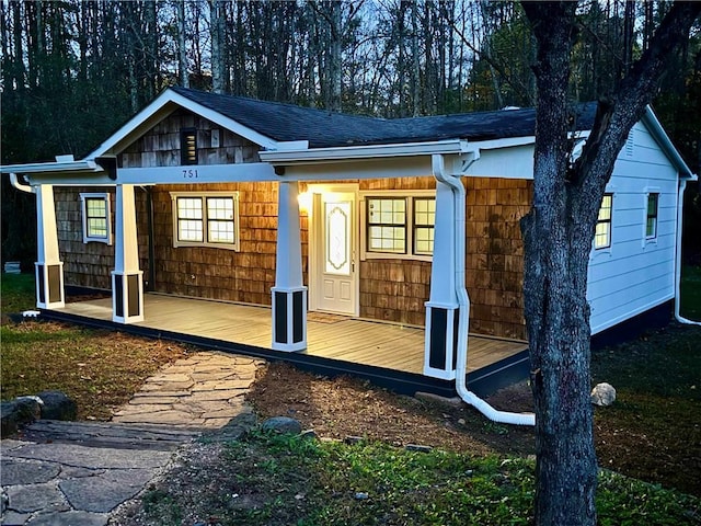 back of house with covered porch