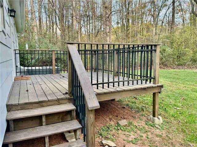 wooden terrace with a yard