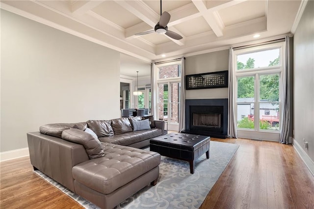 2260 Falkirk Pointe Dr, Marietta, GA 30062 - living area featuring light wood-type flooring, beam ceiling, crown molding, coffered ceiling, and a ceiling fan