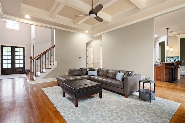 2260 Falkirk Pointe Dr, Marietta, GA 30062 - living room with ceiling fan, stairs, french doors, crown molding, and beamed ceiling