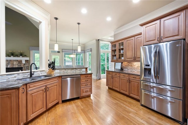 2260 Falkirk Pointe Dr, Marietta, GA 30062 - kitchen featuring appliances with stainless steel finishes, decorative backsplash, light wood-type flooring, plenty of natural light, and recessed lighting