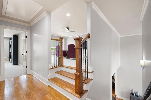 2260 Falkirk Pointe Dr, Marietta, GA 30062 - stairs featuring attic access, wood finished floors, ornamental molding, and a ceiling fan