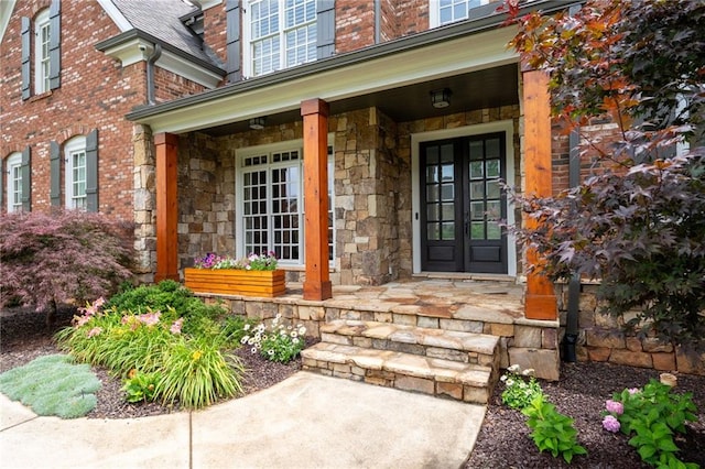 2260 Falkirk Pointe Dr, Marietta, GA 30062 - doorway to property featuring a porch, stone siding, and brick siding