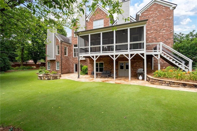 2260 Falkirk Pointe Dr, Marietta, GA 30062 - back of house with a sunroom, brick siding, and a patio