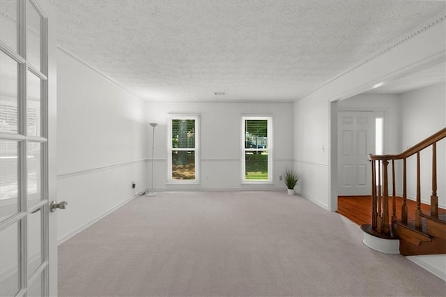 1410 Kingfield Dr, Johns Creek, GA 30005 - empty room featuring carpet, stairs, and a textured ceiling