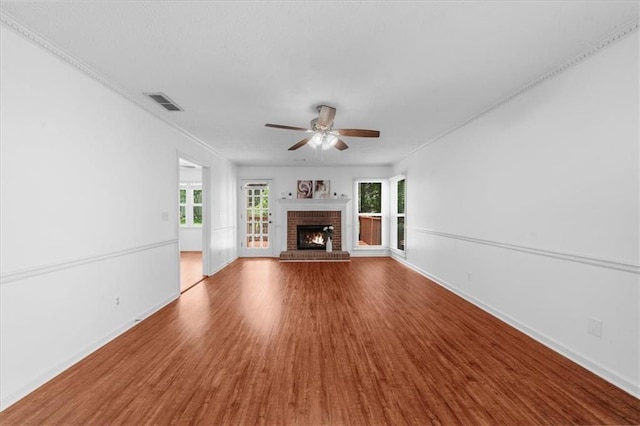 1410 Kingfield Dr, Johns Creek, GA 30005 - unfurnished living room featuring wood finished floors, a ceiling fan, and a brick fireplace