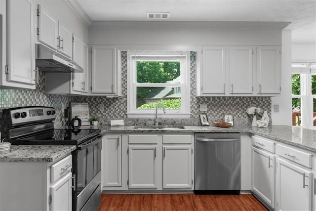 1410 Kingfield Dr, Johns Creek, GA 30005 - kitchen with stainless steel dishwasher, electric range oven, under cabinet range hood, dark wood-type flooring, and backsplash