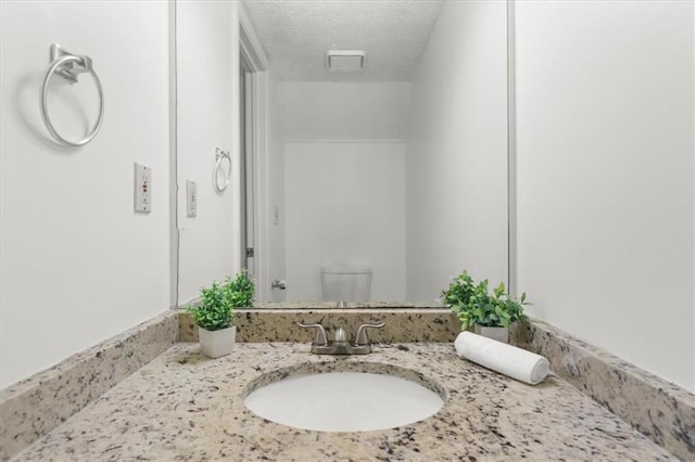 1410 Kingfield Dr, Johns Creek, GA 30005 - bathroom with vanity and a textured ceiling