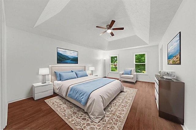 1410 Kingfield Dr, Johns Creek, GA 30005 - bedroom featuring a tray ceiling, wood finished floors, and a ceiling fan