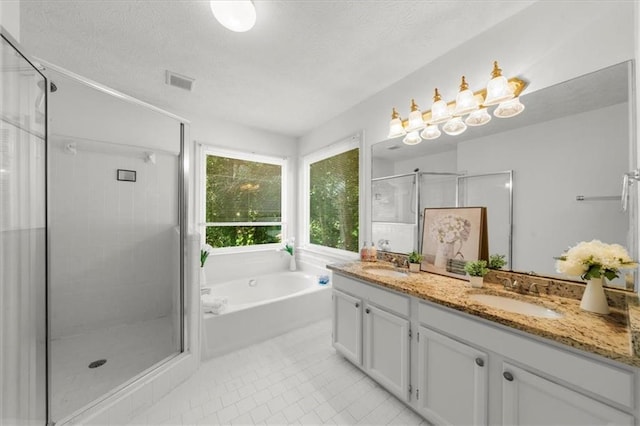 1410 Kingfield Dr, Johns Creek, GA 30005 - full bath featuring a shower stall, double vanity, a garden tub, tile patterned flooring, and a textured ceiling
