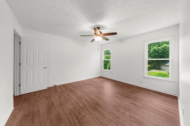 1410 Kingfield Dr, Johns Creek, GA 30005 - unfurnished room with wood finished floors, a ceiling fan, and a textured ceiling