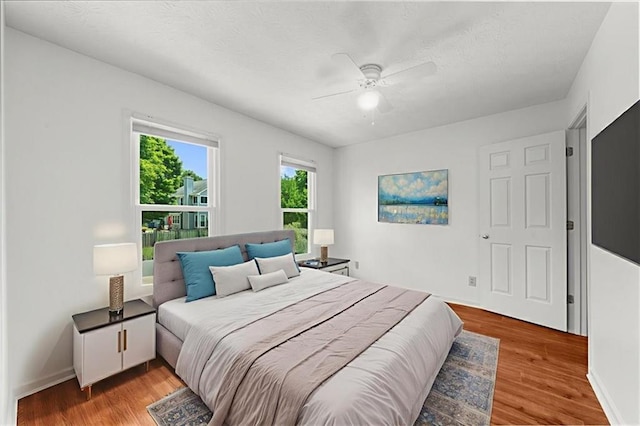 1410 Kingfield Dr, Johns Creek, GA 30005 - bedroom with light wood-style floors and a ceiling fan