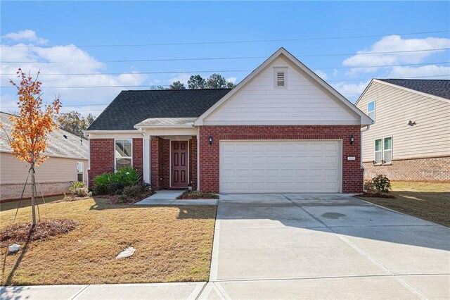 view of front facade with a front lawn and a garage