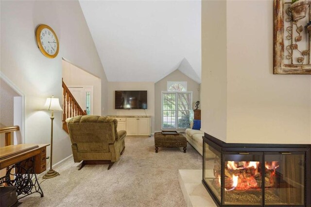 kitchen with wall chimney range hood, decorative backsplash, appliances with stainless steel finishes, and light hardwood / wood-style floors