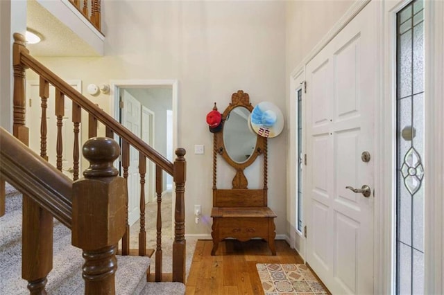 entryway with hardwood / wood-style floors