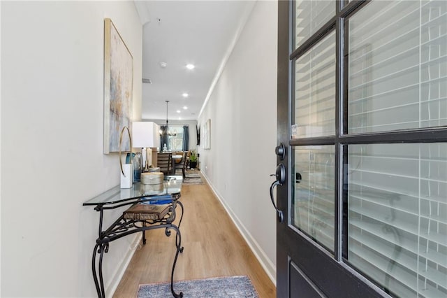 entrance foyer featuring a chandelier, recessed lighting, visible vents, baseboards, and light wood-style floors