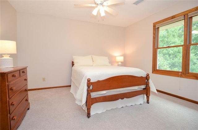 4366 Cedar Wood Dr SW, Lilburn, GA 30047 - bedroom featuring light carpet, baseboards, and a ceiling fan
